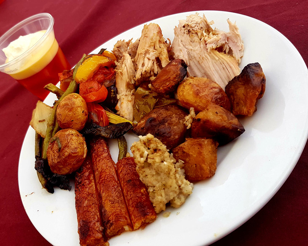 Plate of food for hog roast event